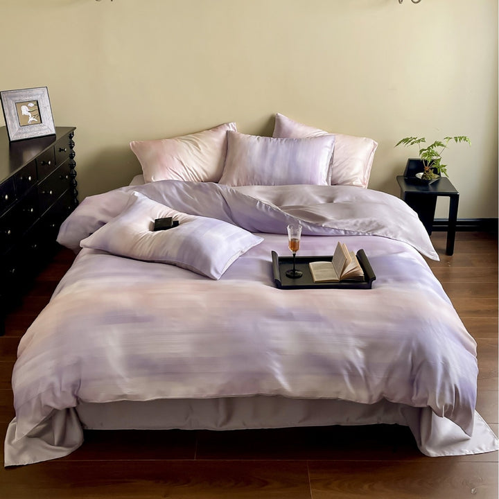 Luxurious Mako satin bedding set with gentle watercolor gradient and concealed hotel closure
