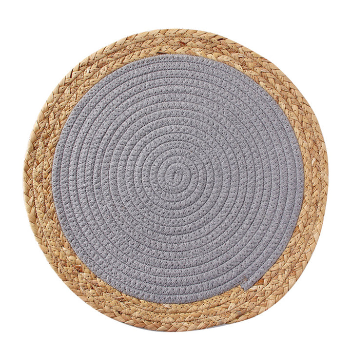Round handwoven table placemat made of cotton yarn with structured spiral binding