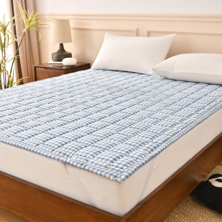 Padded quilted mattress topper with microfiber cover and non-slip bottom