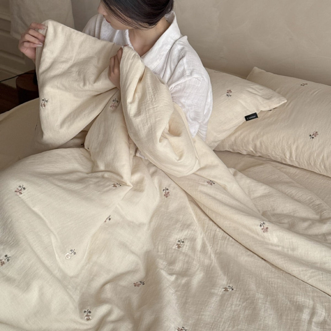 Linen bedding set with subtle floral embroidery