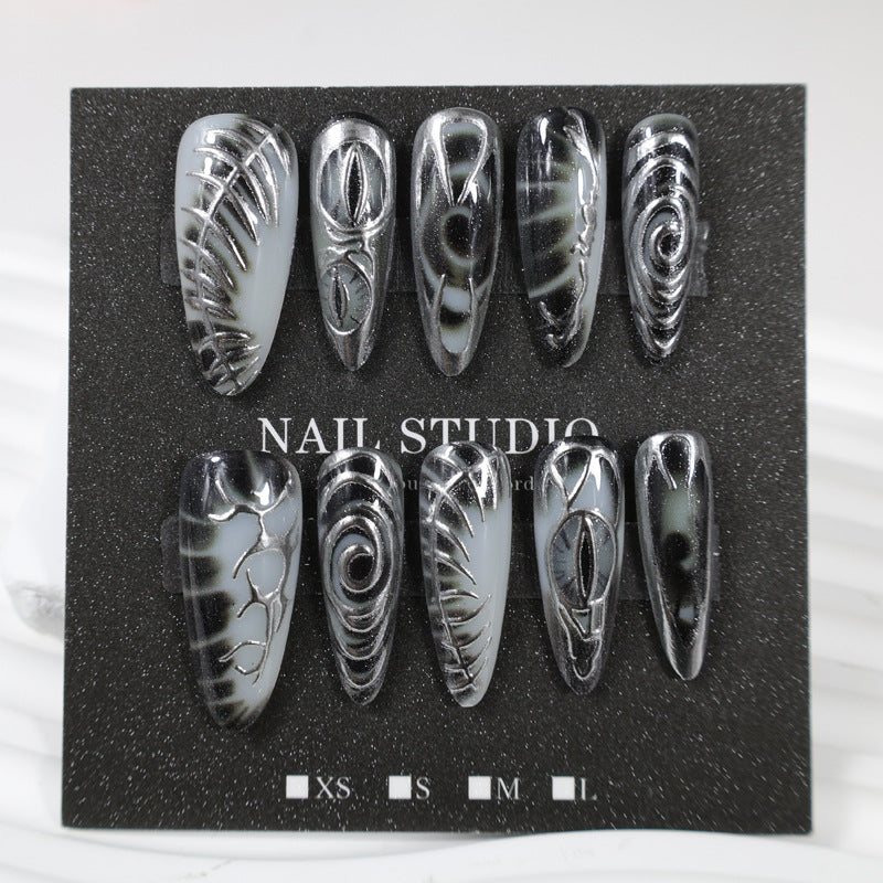 Artificial nail set with modern spiral pattern and shiny accents Bowlift