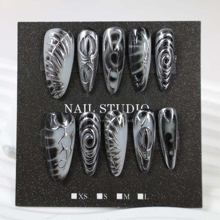 Artificial nail set with modern spiral pattern and shiny accents Bowlift
