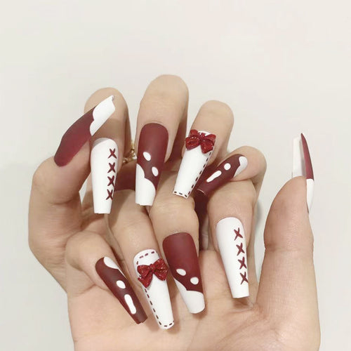 Artful stiletto nails with bow and zigzag design Bowlift