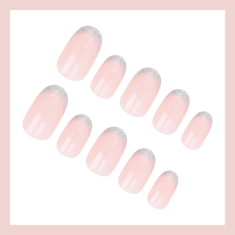 Acrylic nail set with elegant French tip and glitter accents Bowlift