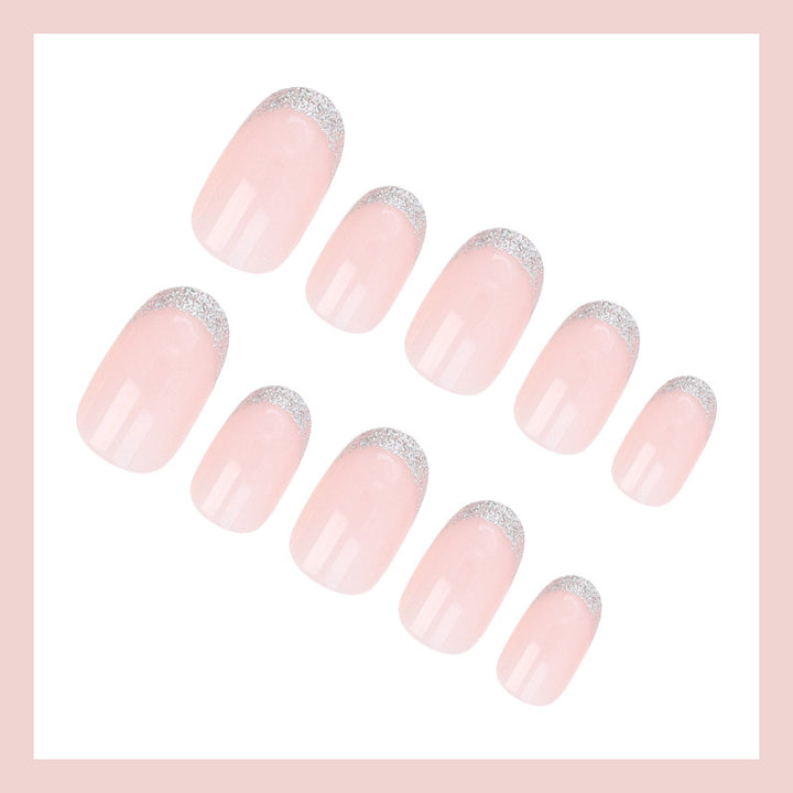 Acrylic nail set with elegant French tip and glitter accents Bowlift