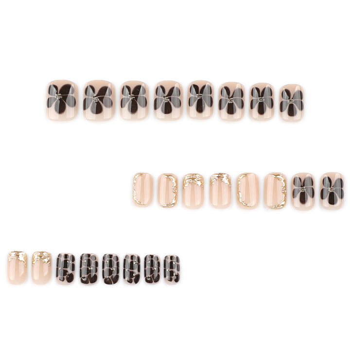 Artistic Nail Art with Elegant Golden Accents Bowlift