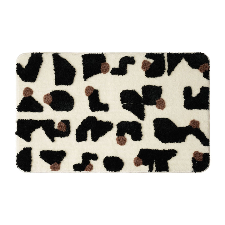 Tufted bathroom mat in abstract leopard pattern with soft high pile Bowlift