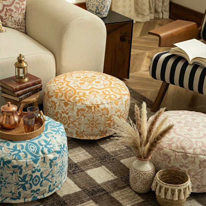 Round floor pouf with woven ornament pattern and carrying handle Bowlift