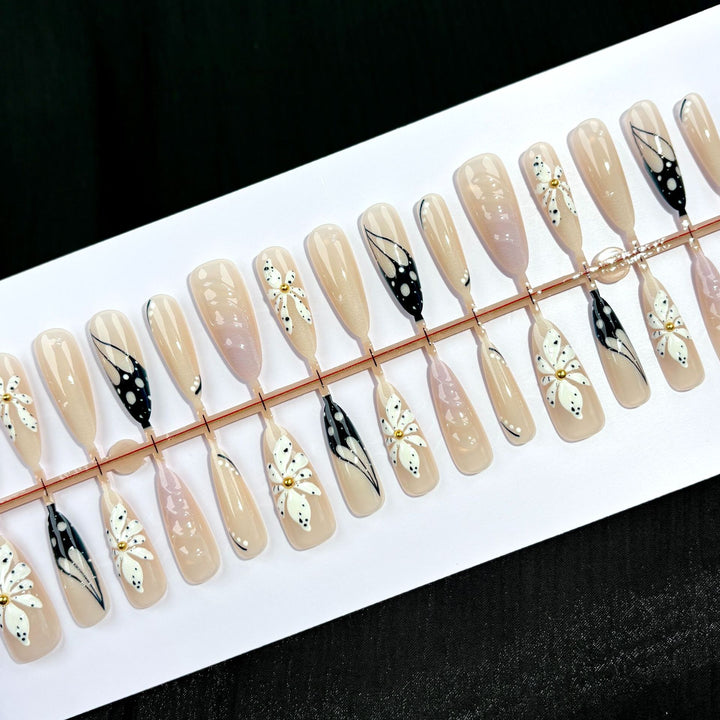 Artistic Press-On Nail Set with Floral and Abstract Designs