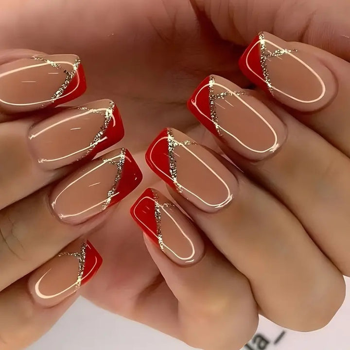 Artificial nails with luxurious gold and red accent design Bowlift
