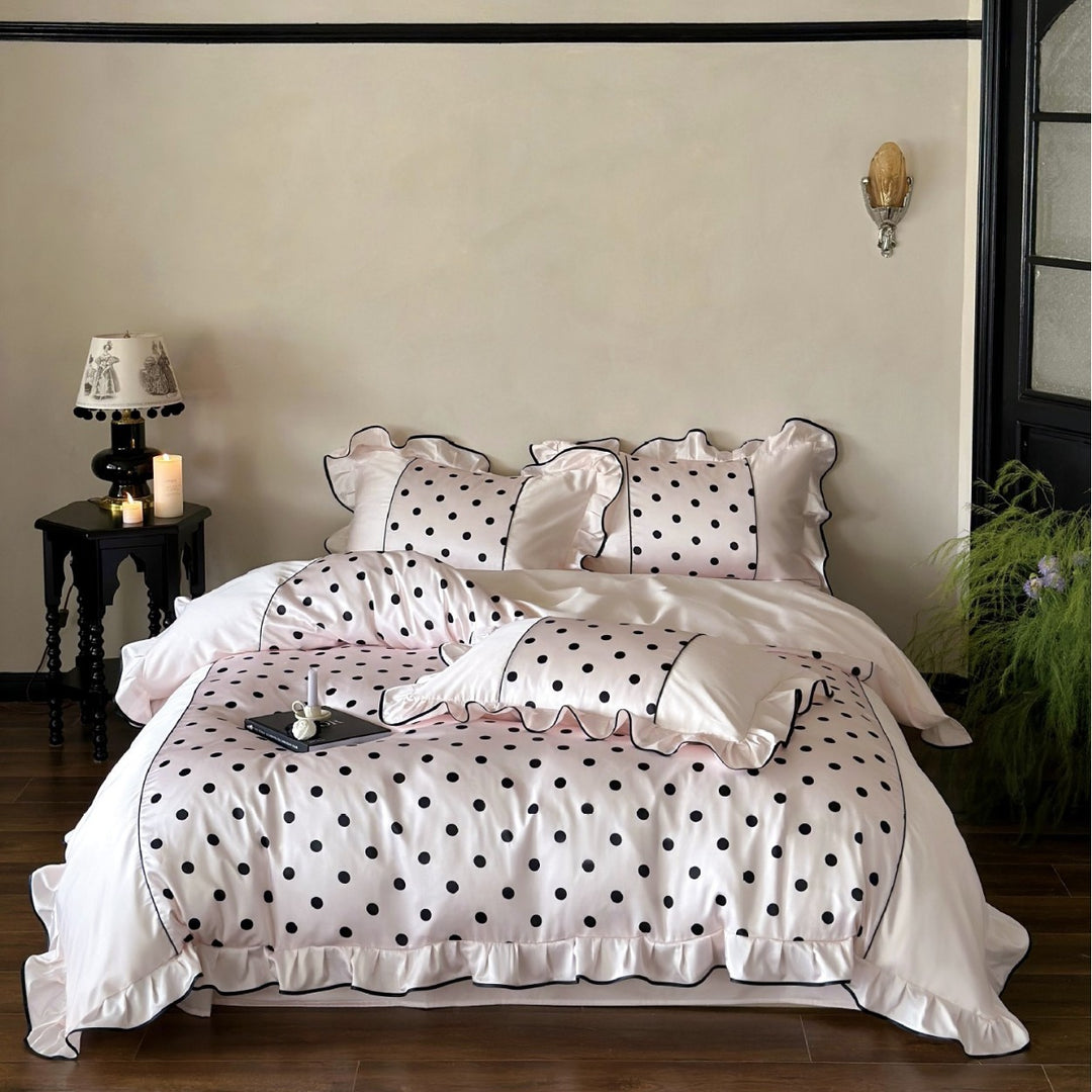 Luxurious satin bedding set with polka dot design, ruffle and contrast piping
