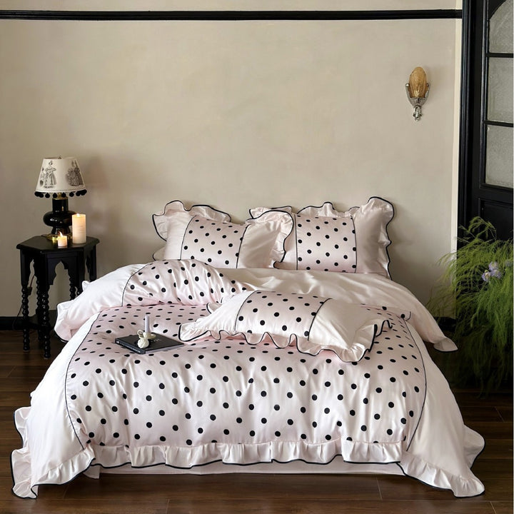 Luxurious satin bedding set with polka dot design, ruffle and contrast piping