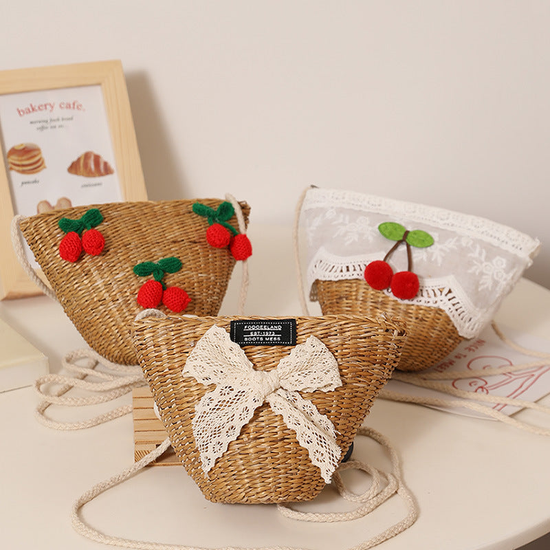 Playful straw shoulder bag with floral accents Bowlift