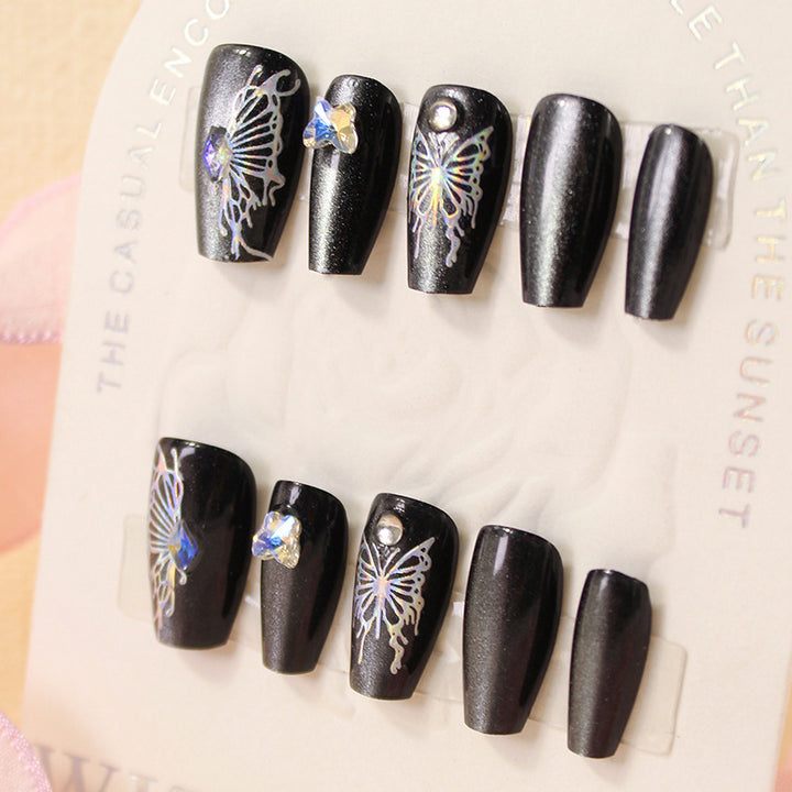 Artificial nails with decorative butterfly designs and glitter accents Bowlift