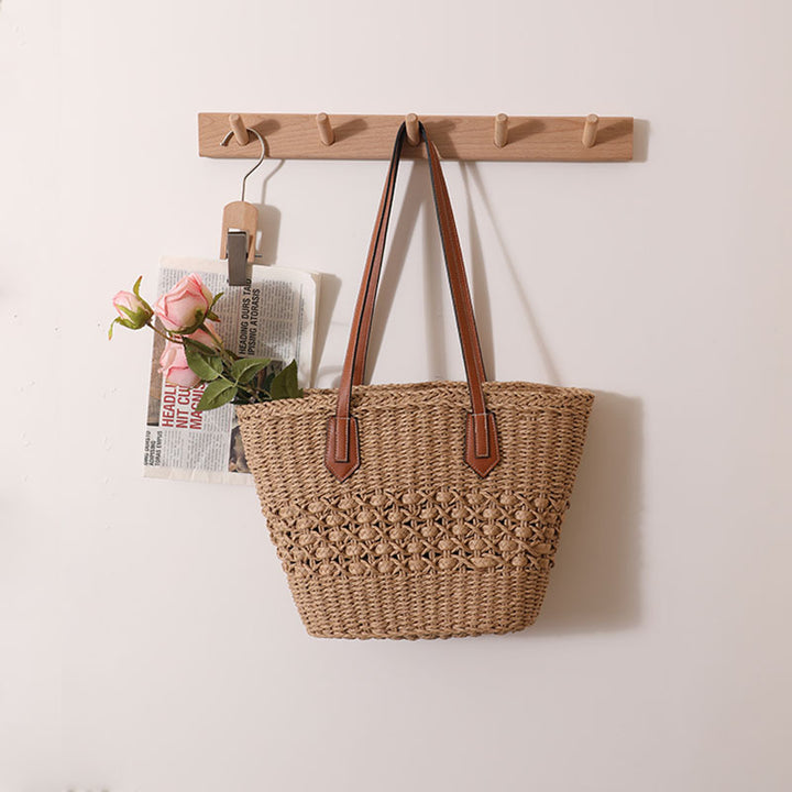 Handcrafted rattan basket bag with elegant leather accents Bowlift