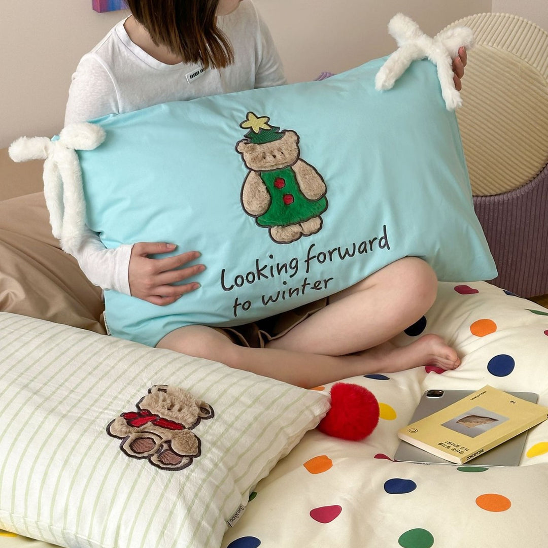 Playful cotton bedding set with pompom trim and embroidered rabbit motif