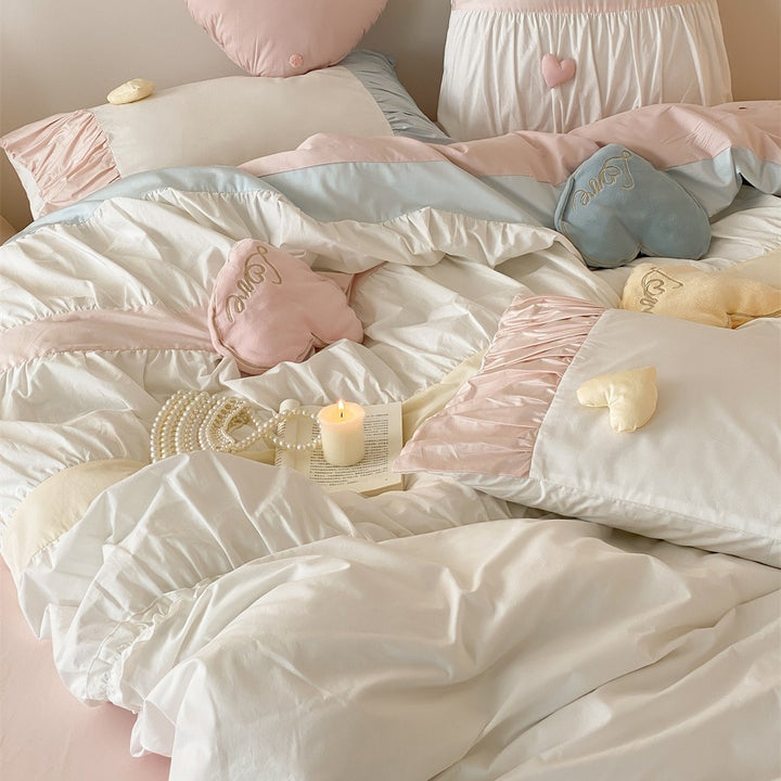 Bedding set with gathered pleat look, heart appliqués and ruffle