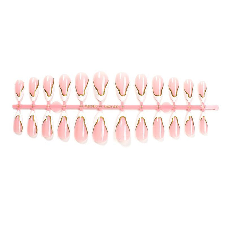 Artifical nail set with elegant gold trim and delicate pink Bowlift