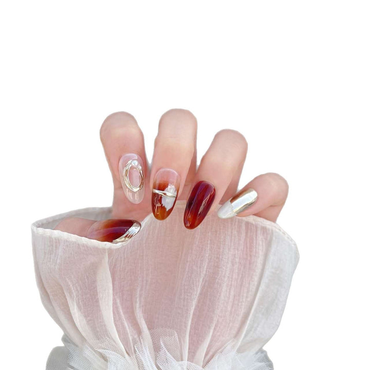 Stylish Press-On Nail Art Set with Unique Metallic and Marble Designs