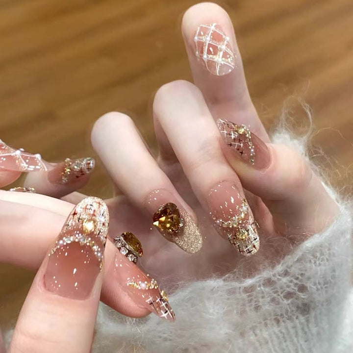 Artificial nails with glitter and heart accents Bowlift