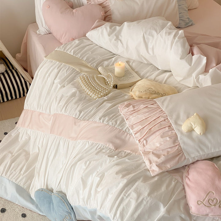 Bedding set with gathered pleat look, heart appliqués and ruffle