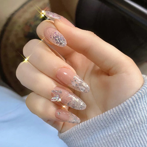 Glittering stiletto nails with elegant decorations Bowlift