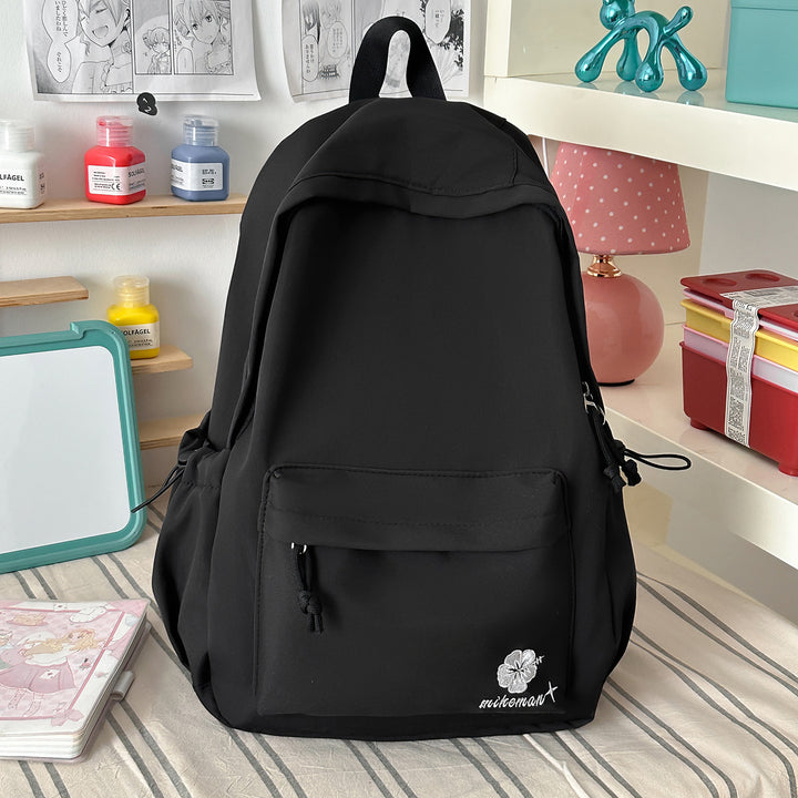 Versatile Lightweight Backpack with Decorative Accents Bowlift