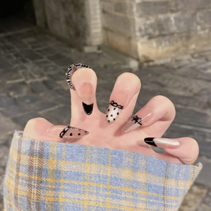 Artistic Glittered Stiletto Nail Enhancements