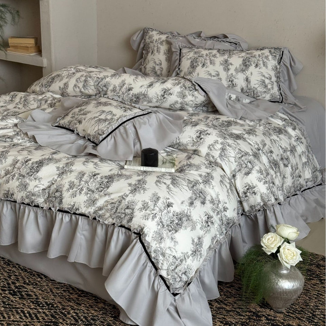 Bedding set with ruffles and toile pattern