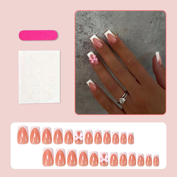 Acrylic nail set with elegant tips and playful bows Bowlift