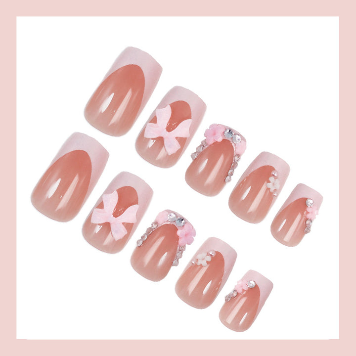 Artificial nail set with playful bows and elegant floral decorations Bowlift