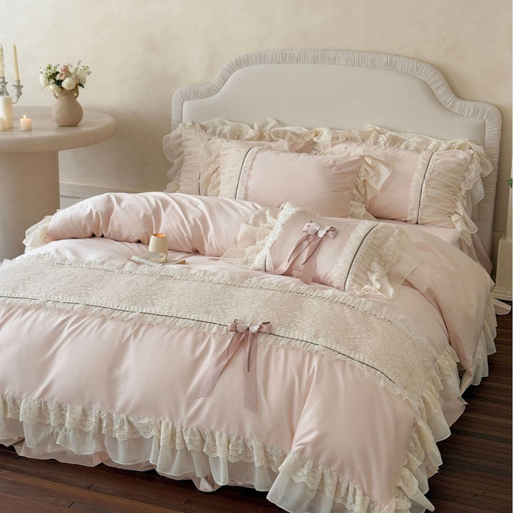 Luxury bedding set with ruffles, lace border, and decorative bow appliqués