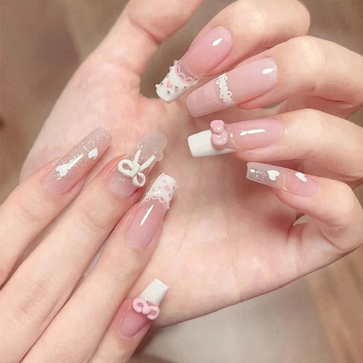 Artistic Press-On Nail Extensions with Floral Embellishments Bowlift