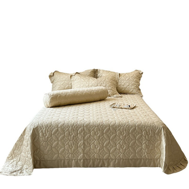 Quilt-bedspread set with embossed floral relief and neck roll