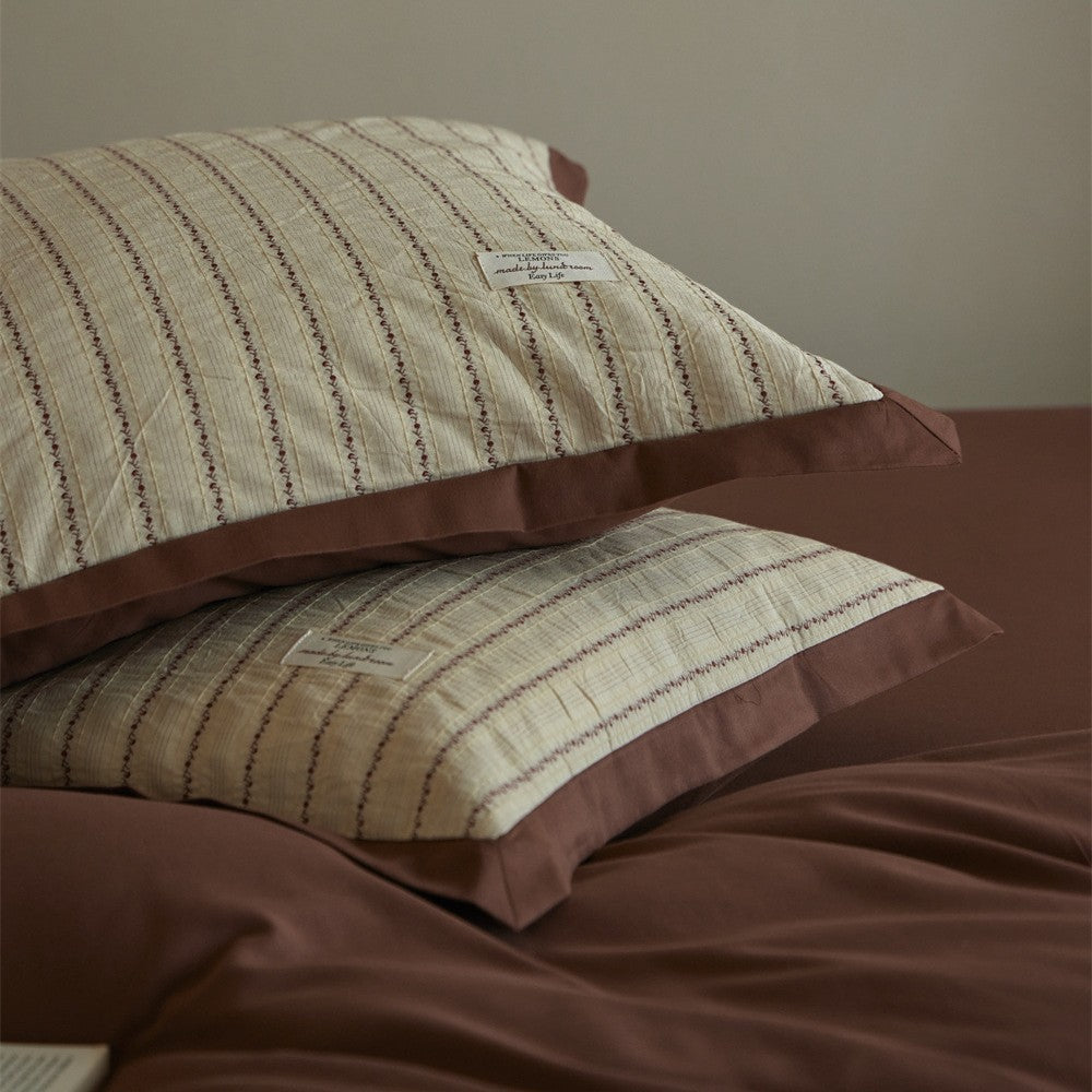 Luxurious cotton bedding set with ruffled trim and pillowcases