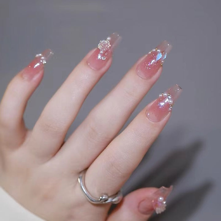 Glamorous artificial nails with delicate flower and glitter effects Bowlift