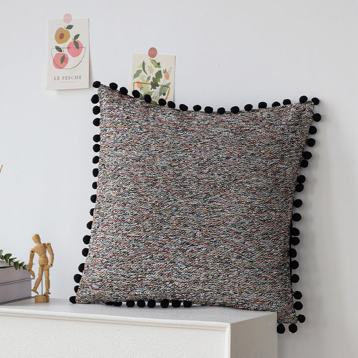 Square cushion cover with pompom trim and mottled boucle structure Bowlift