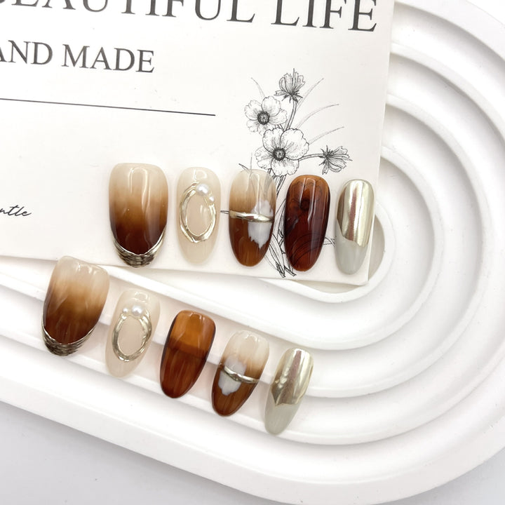 Stylish Press-On Nail Art Set with Unique Metallic and Marble Designs