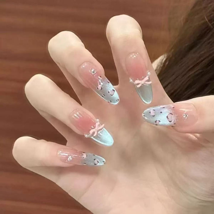 Artistic Stiletto Nail Enhancements with Decorative Accents