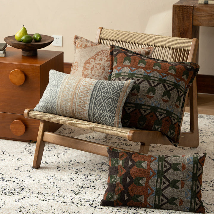 Square decorative sofa cushion with jacquard-woven ornament and soft bouclé surface Bowlift
