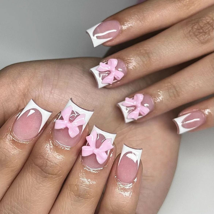 Acrylic nail set with playful bow design Bowlift