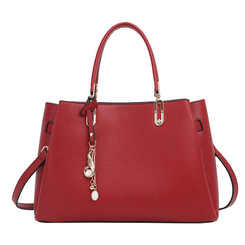 Elegant Structured Handbag with Charm Detail