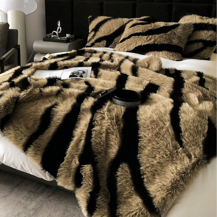 Faux fur bedspread with zebra pattern and decorative pillow set