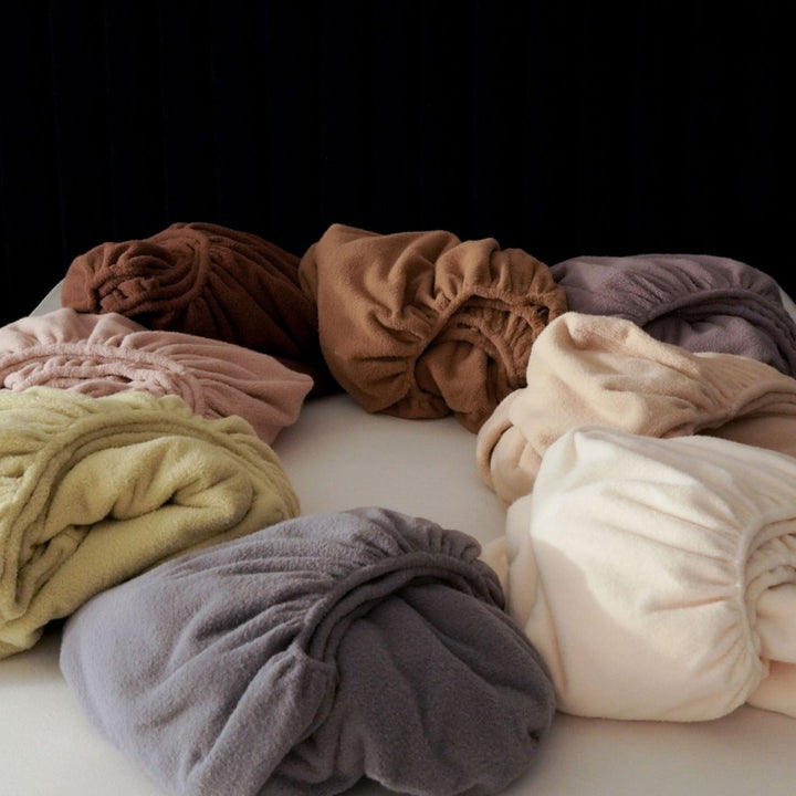 Terry fitted sheet with deep tuck-in and elastic all-around rubber