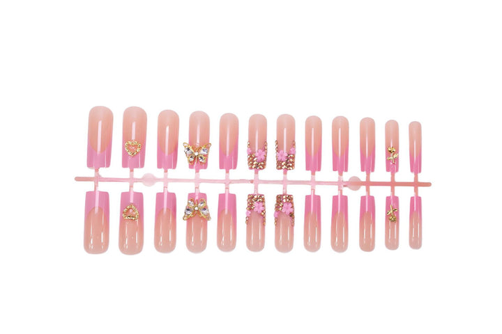 Artificial nail extension with glamorous embellishments Bowlift