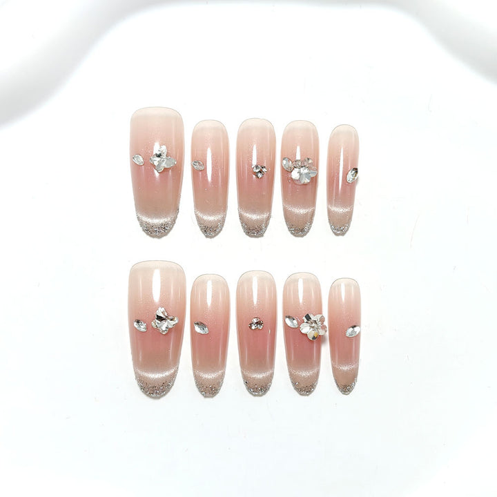 Glamorous artificial nails with glitter decorations Bowlift