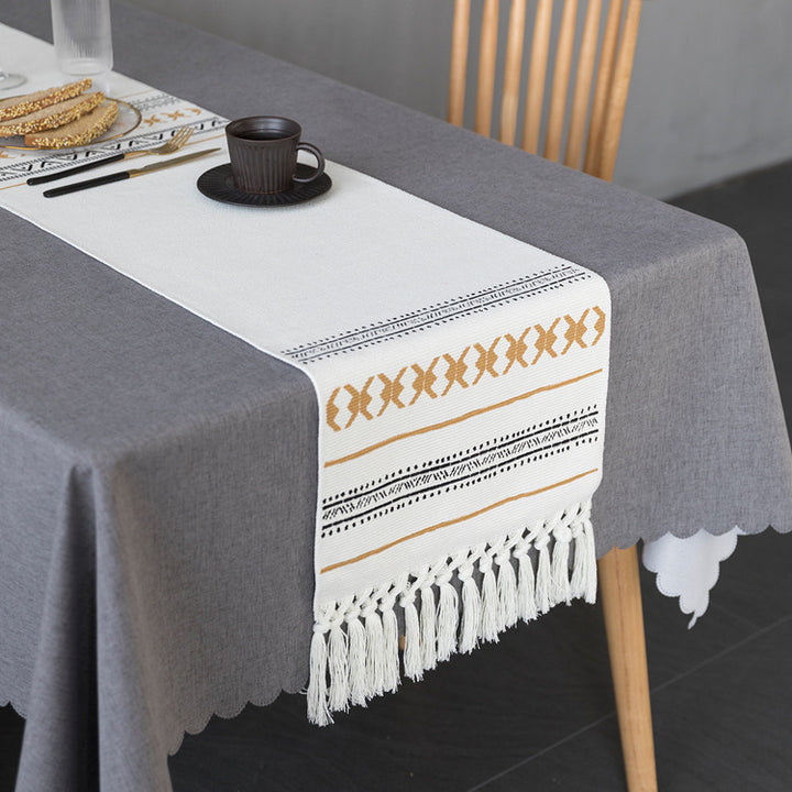 Woven Boho table runner made of cotton blend with decorative fringes and graphic stripe pattern Bowlift