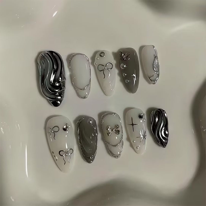 Nail set with luxurious 3D decorations and elegant stone accents Bowlift
