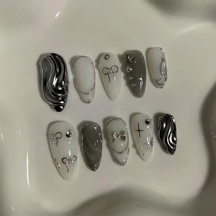 Nail set with luxurious 3D decorations and elegant stone accents Bowlift