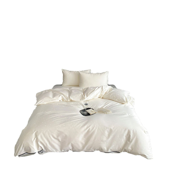 Satin bedding set with fine structure detailing and decorative piping